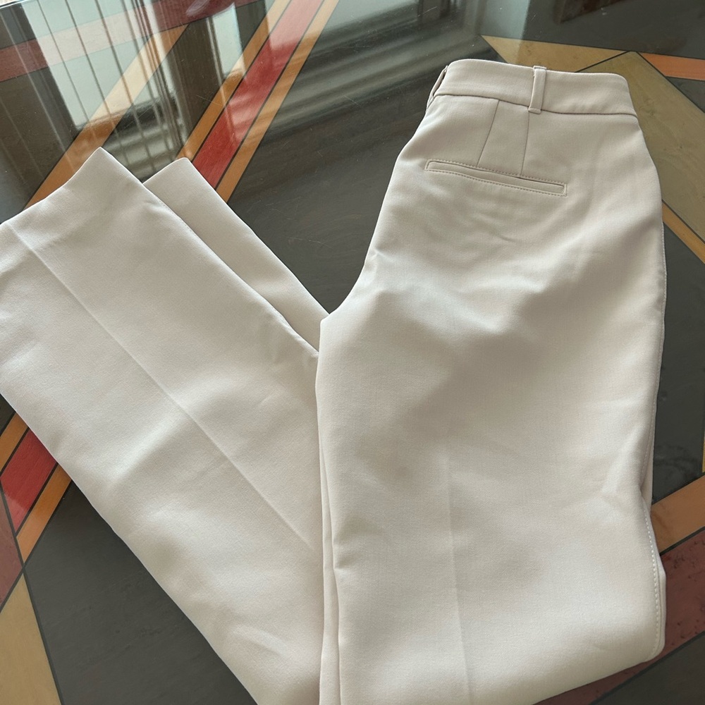 White House Black Market beige boot cut pants.